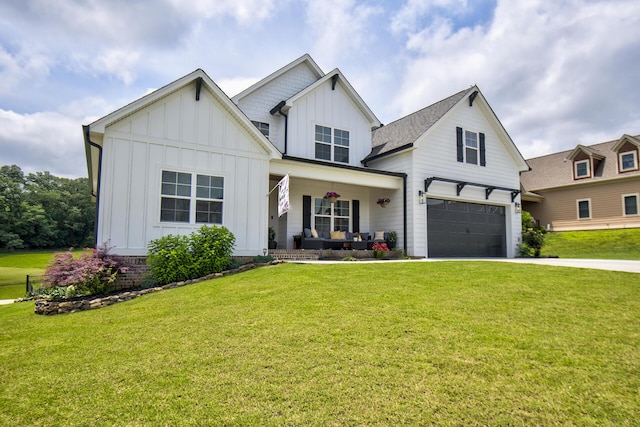 9117 Sir Hudson Ct, Harrison, TN 37341 - modern farmhouse style home featuring covered porch, board and batten siding, an attached garage, driveway, and a front lawn
