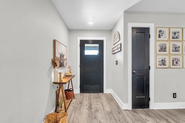 329 Windsong Dr, Lafayette, GA 30728 - foyer entrance with light wood-style flooring and baseboards