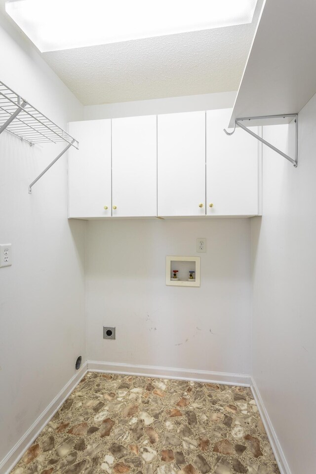 8275 Stillwater Cir, Ooltewah, TN 37363 - laundry room featuring washer hookup, hookup for an electric dryer, cabinet space, baseboards, and stone finish floors