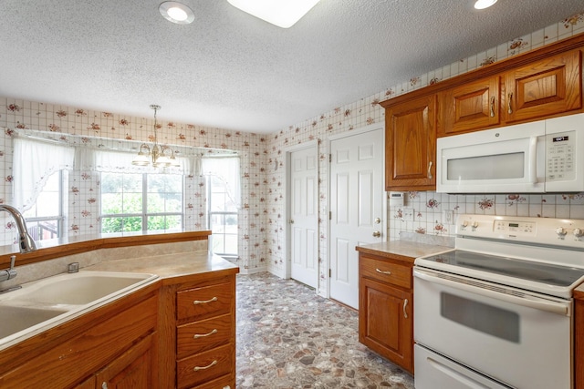 8275 Stillwater Cir, Ooltewah, TN 37363 - kitchen featuring white appliances, a sink, brown cabinets, a textured ceiling, and light countertops