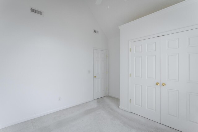 8275 Stillwater Cir, Ooltewah, TN 37363 - unfurnished bedroom featuring lofted ceiling, light colored carpet, baseboards, a closet, and ceiling fan