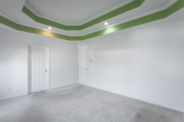 8275 Stillwater Cir, Ooltewah, TN 37363 - spare room featuring carpet flooring, ornamental molding, baseboards, recessed lighting, and a tray ceiling