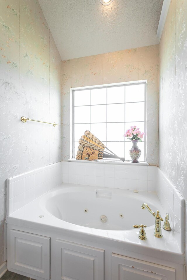 8275 Stillwater Cir, Ooltewah, TN 37363 - bathroom featuring wallpapered walls, a whirlpool tub, and a textured ceiling