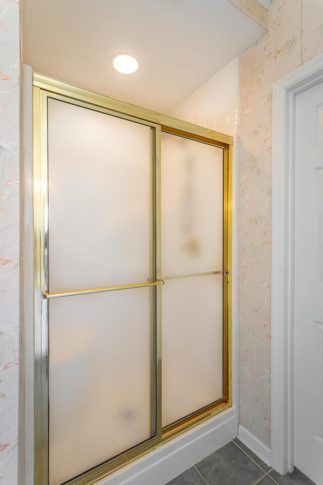 8275 Stillwater Cir, Ooltewah, TN 37363 - bathroom featuring wallpapered walls, an enclosed shower, tile patterned flooring, baseboards, and recessed lighting