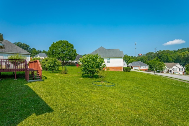 8275 Stillwater Cir, Ooltewah, TN 37363 - view of grassy yard with a deck and stairway