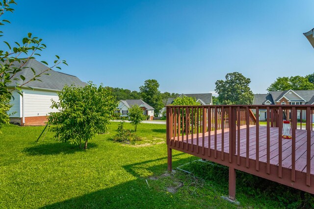 8275 Stillwater Cir, Ooltewah, TN 37363 - view of green lawn with a wooden deck and a residential view