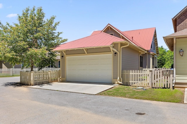 8580 Festival Loop, Chattanooga, TN 37419 - view of front of house with an attached garage, driveway, and metal roof