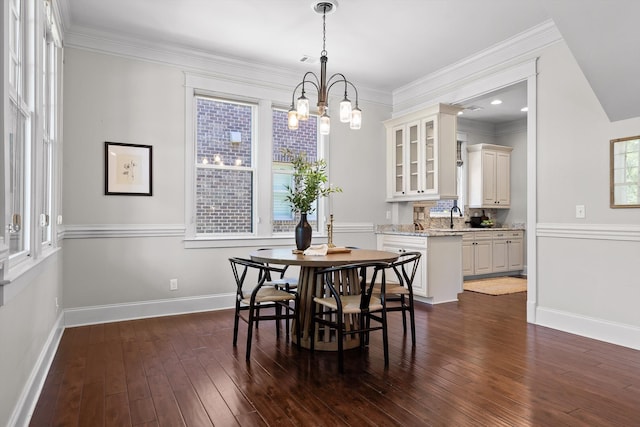 8580 Festival Loop, Chattanooga, TN 37419 - dining room featuring a chandelier, baseboards, dark wood-style floors, and crown molding