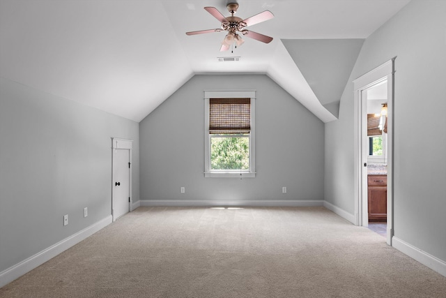 8580 Festival Loop, Chattanooga, TN 37419 - additional living space with light carpet, lofted ceiling, ceiling fan, and baseboards