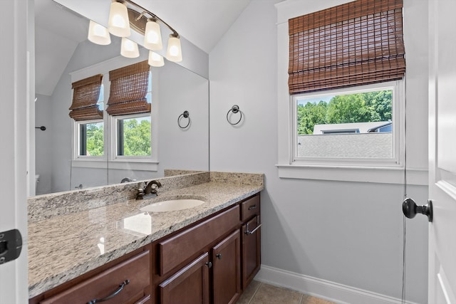 8580 Festival Loop, Chattanooga, TN 37419 - bathroom with vaulted ceiling, vanity, baseboards, and tile patterned floors