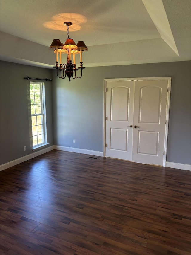 12466 Alabama Hwy, Ringgold, GA 30736 - empty room featuring dark wood-type flooring, a chandelier, and baseboards
