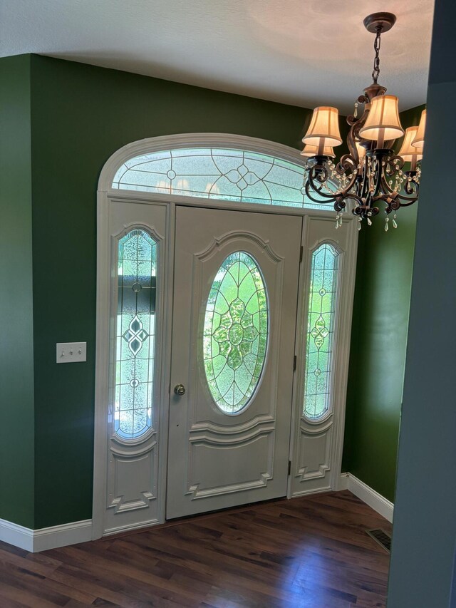 12466 Alabama Hwy, Ringgold, GA 30736 - entryway featuring a chandelier, dark wood-style flooring, and baseboards