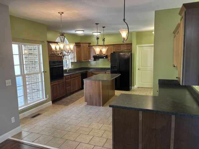 12466 Alabama Hwy, Ringgold, GA 30736 - kitchen featuring black appliances, a sink, dark countertops, and healthy amount of natural light