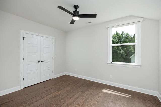 306 Stonegate Way, Soddy Daisy, TN 37379 - unfurnished bedroom featuring dark wood-style flooring, a closet, and a ceiling fan