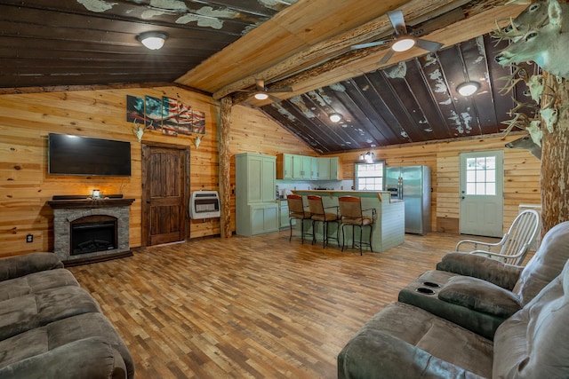 253 Hartline Rd, Trenton, GA 30752 - living area with heating unit, wooden walls, a ceiling fan, light wood-type flooring, and vaulted ceiling