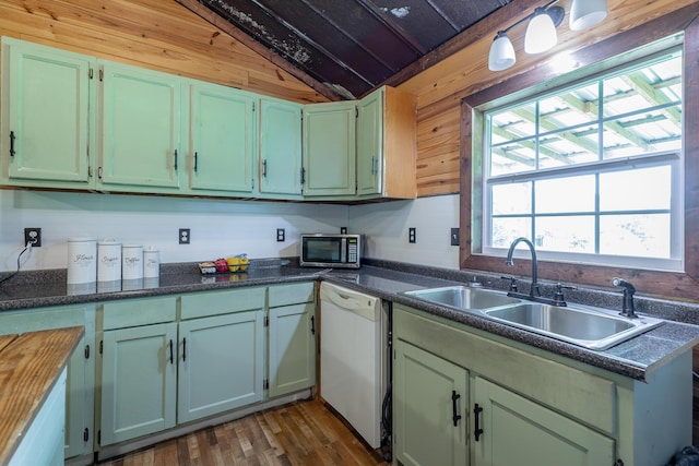 253 Hartline Rd, Trenton, GA 30752 - kitchen featuring dishwasher, vaulted ceiling, stainless steel microwave, a sink, and dark wood-style floors