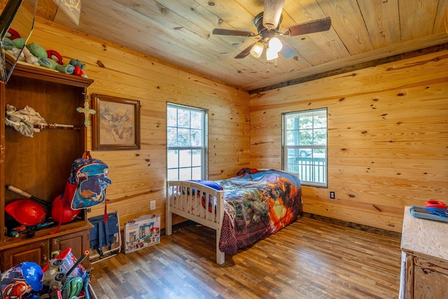 253 Hartline Rd, Trenton, GA 30752 - bedroom with multiple windows, wood finished floors, wood walls, wood ceiling, and ceiling fan