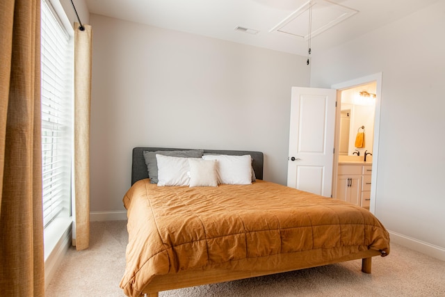 1967 Read Ave, Chattanooga, TN 37408 - bedroom with attic access, light carpet, baseboards, and ensuite bathroom