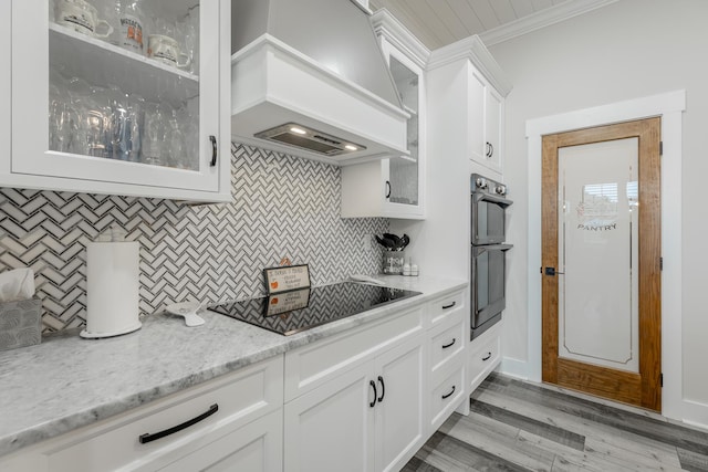 15 Breckinridge Dr, Chickamauga, GA 30707 - kitchen with custom exhaust hood, black electric stovetop, ornamental molding, tasteful backsplash, and double oven