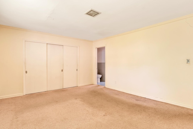 208 Barbara Ln, Chattanooga, TN 37411 - unfurnished bedroom featuring ornamental molding, carpet, baseboards, and a closet