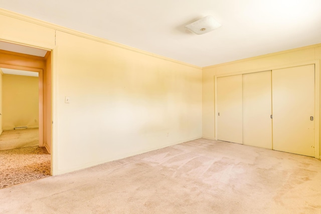 208 Barbara Ln, Chattanooga, TN 37411 - unfurnished bedroom with light colored carpet, crown molding, a closet, and baseboards