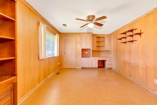 208 Barbara Ln, Chattanooga, TN 37411 - unfurnished living room featuring a ceiling fan, baseboards, wood walls, and light flooring