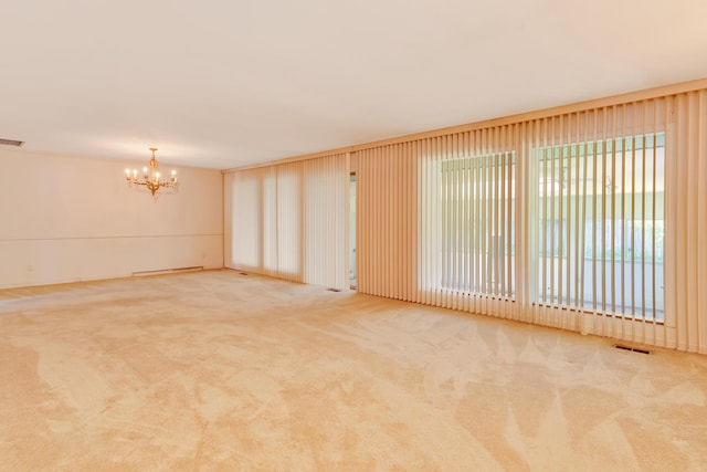 208 Barbara Ln, Chattanooga, TN 37411 - unfurnished room featuring a chandelier and carpet