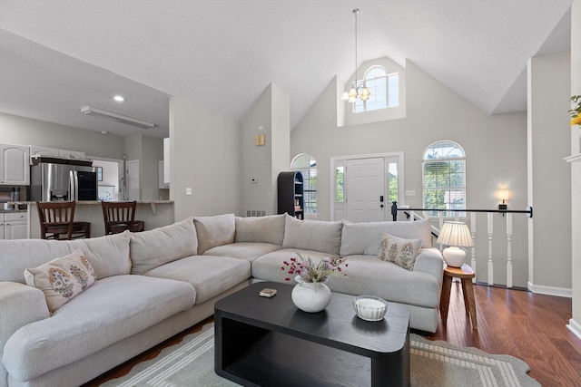 6443 Olde Ferry Lndg, Harrison, TN 37341 - living room with a chandelier, wood finished floors, lofted ceiling, and baseboards