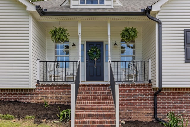 6443 Olde Ferry Lndg, Harrison, TN 37341 - view of exterior entry featuring a shingled roof and covered porch