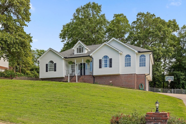 6443 Olde Ferry Lndg, Harrison, TN 37341 - view of front of house featuring a front lawn, covered porch, driveway, and a shingled roof