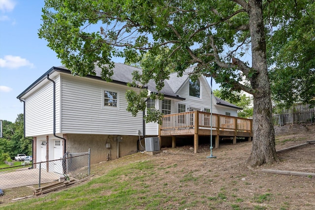 6443 Olde Ferry Lndg, Harrison, TN 37341 - back of property featuring a deck, an attached garage, a shingled roof, and driveway