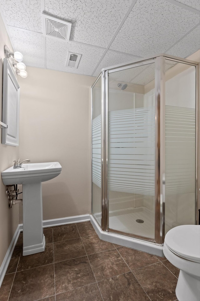 6443 Olde Ferry Lndg, Harrison, TN 37341 - full bathroom with a drop ceiling, toilet, baseboards, and a shower stall