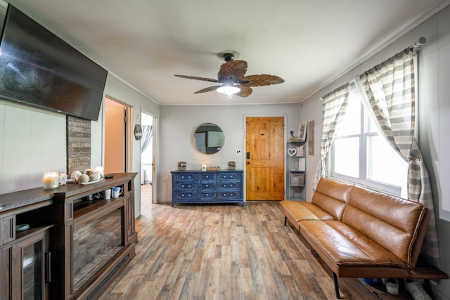 4813 Blue Bell Ave, Ooltewah, TN 37363 - living room with light wood-style floors, crown molding, and a ceiling fan