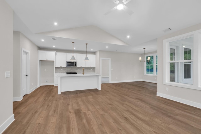 2732 Butlers Green Cir Unit 27, Chattanooga, TN 37421 - unfurnished living room with vaulted ceiling, wood finished floors, ceiling fan, recessed lighting, and baseboards