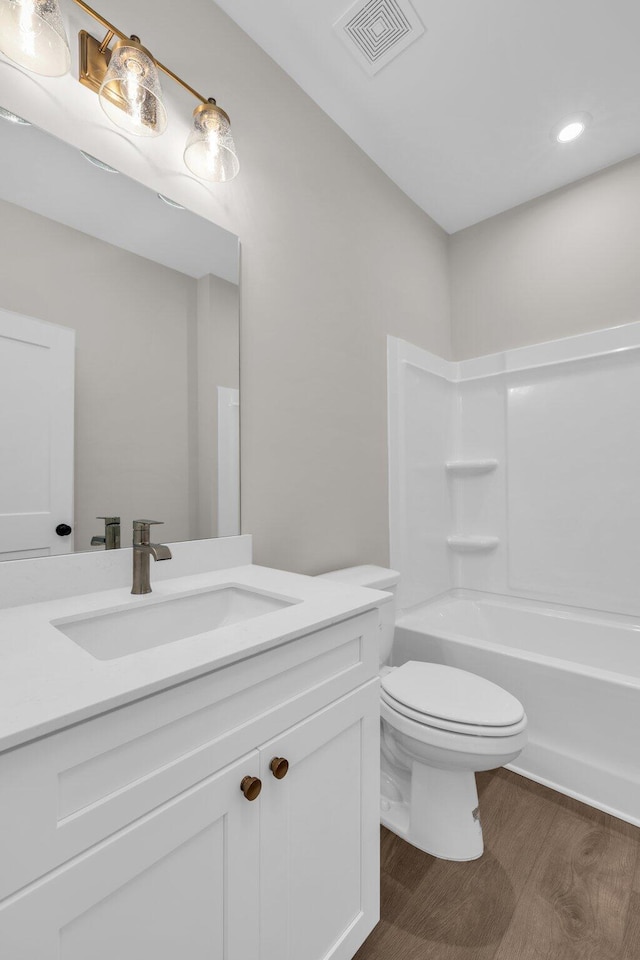2732 Butlers Green Cir Unit 27, Chattanooga, TN 37421 - bathroom featuring vanity, toilet, wood finished floors, recessed lighting, and shower / washtub combination