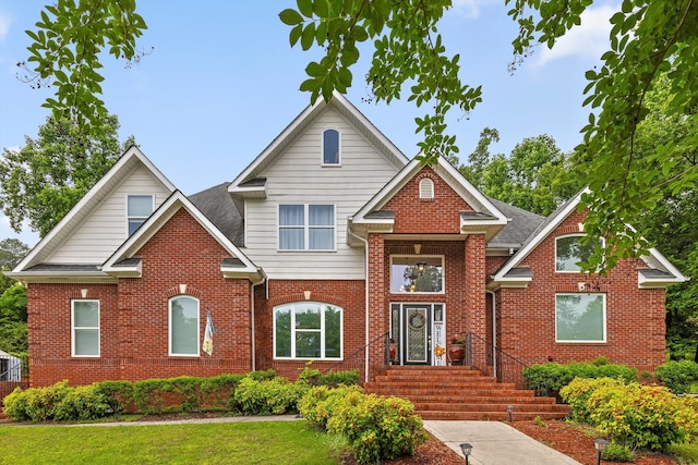 604 Lenna Ln, Dalton, GA 30720 - traditional-style home with brick siding, roof with shingles, and a front yard