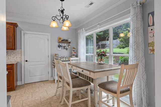 604 Lenna Ln, Dalton, GA 30720 - dining room featuring crown molding and a chandelier