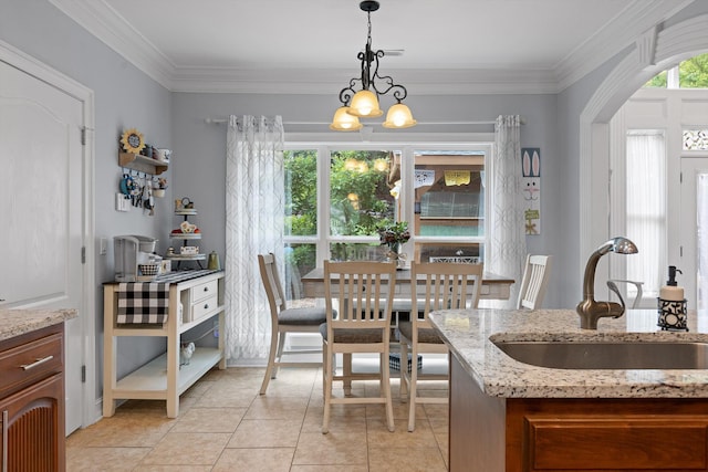 604 Lenna Ln, Dalton, GA 30720 - dining room with light tile patterned floors, ornamental molding, and a chandelier