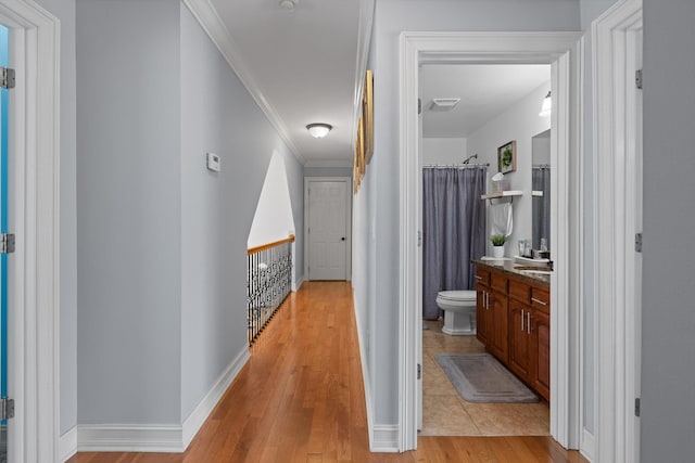 604 Lenna Ln, Dalton, GA 30720 - corridor featuring an upstairs landing, crown molding, light wood-style floors, and baseboards