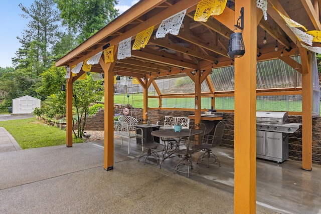 604 Lenna Ln, Dalton, GA 30720 - fenced backyard featuring a patio area, area for grilling, outdoor dining space, and a storage unit