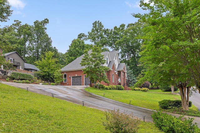604 Lenna Ln, Dalton, GA 30720 - view of front of home featuring brick siding, concrete driveway, and a front lawn