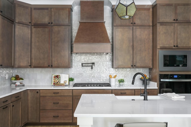 1522 Little Sorrel Rd Unit 034, Hixson, TN 37343 - kitchen with oven, custom range hood, stainless steel gas cooktop, built in microwave, and light countertops