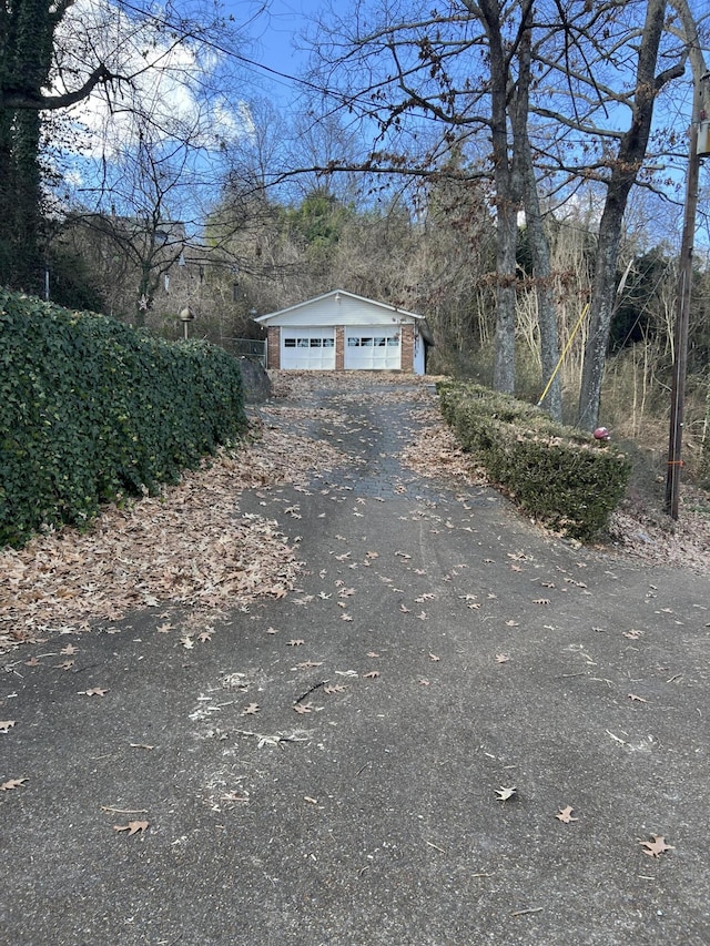 3415 Bennett Rd, Chattanooga, TN 37412 - view of side of property with a detached garage and an outdoor structure