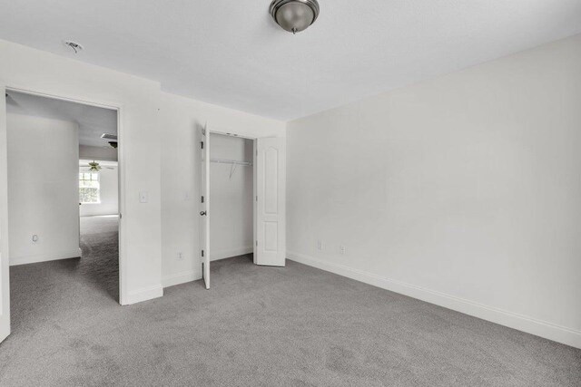 1770 Thrasher Pike, Hixson, TN 37343 - unfurnished bedroom with carpet floors, baseboards, and a closet