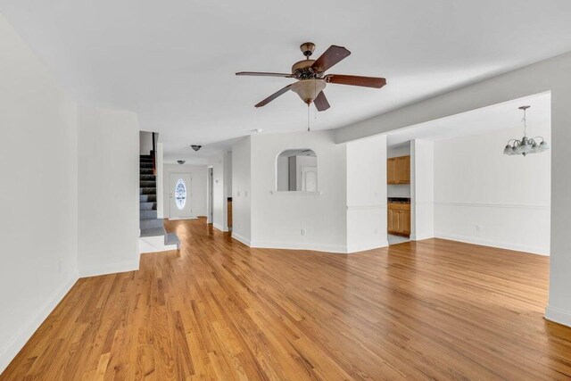 1770 Thrasher Pike, Hixson, TN 37343 - unfurnished living room with stairway, light wood-style floors, and ceiling fan