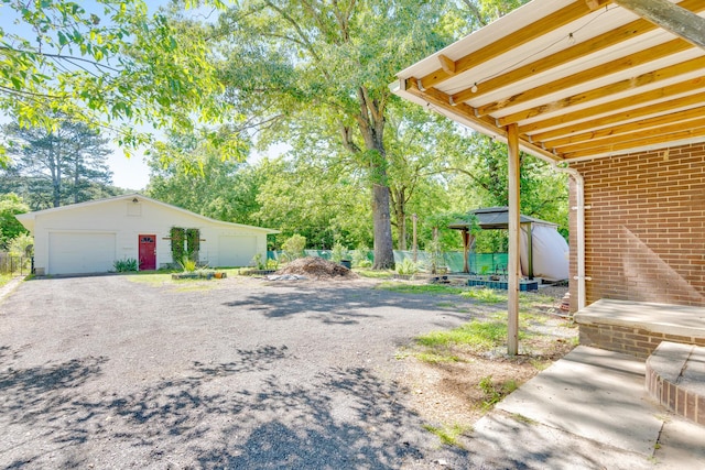 1615 Wilson Rd, Rossville, GA 30741 - view of yard featuring an outbuilding, a garage, and view of scattered trees