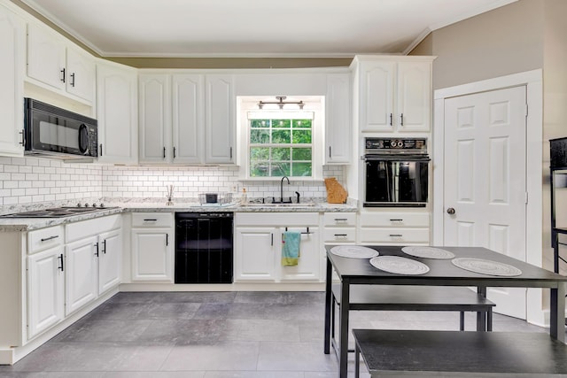 1615 Wilson Rd, Rossville, GA 30741 - kitchen with black appliances, a sink, white cabinets, backsplash, and ornamental molding