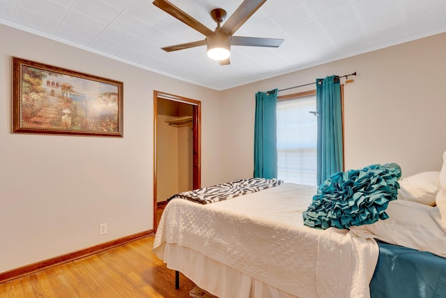 1615 Wilson Rd, Rossville, GA 30741 - bedroom with light wood-style flooring, ornamental molding, baseboards, ceiling fan, and a closet