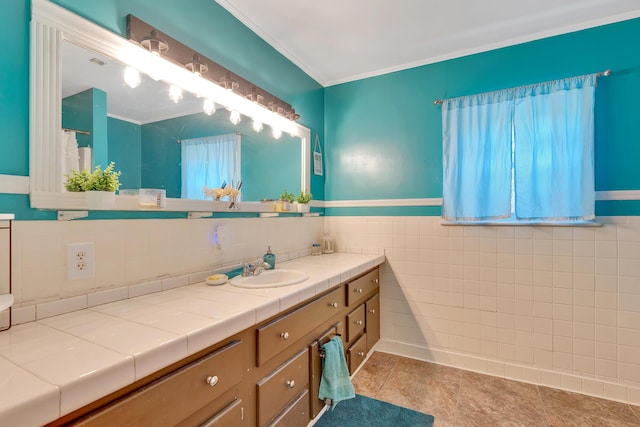 1615 Wilson Rd, Rossville, GA 30741 - bathroom featuring vanity, tile walls, tile patterned flooring, wainscoting, and ornamental molding