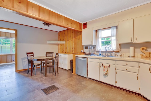 1615 Wilson Rd, Rossville, GA 30741 - kitchen featuring dishwasher, light countertops, plenty of natural light, wood walls, and crown molding